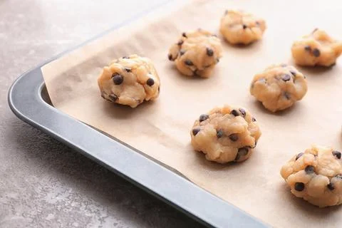 Cookie dough with chocolate chips on baking sheet, closeup Stock-Fotos