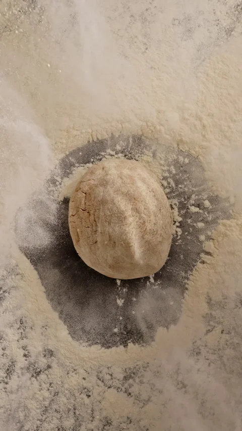Cookie dough falls on flour, bursting powder in slow motion. 動画素材 320835286