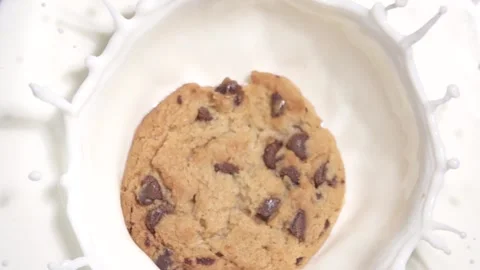 Cookie Falling into Milk in Slow Motion Stock Footage 146569489