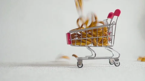Cookie inside supermarket cart. Biscuits falls in supermarket cart. 스톡 동영상 100341231