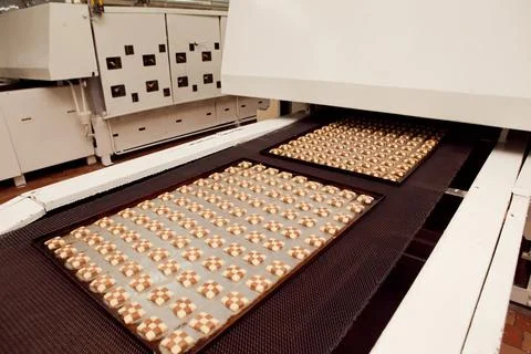 Cookie making machine in the factory Stock Photos