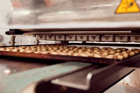 Cookie making machine in the factory Stock Photos