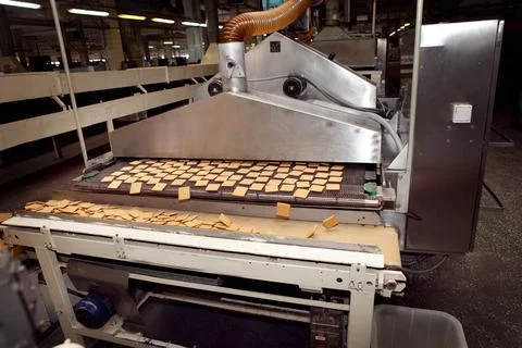 Cookie making machine in the factory Stock Photos