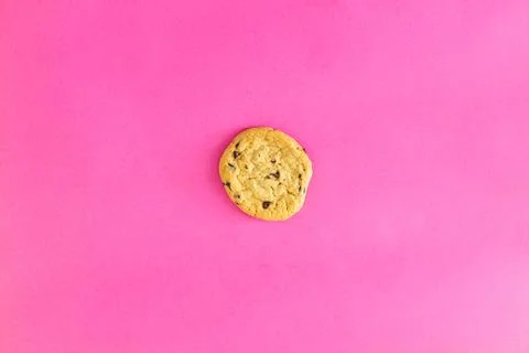 A cookie is on a pink background Stock Photos
