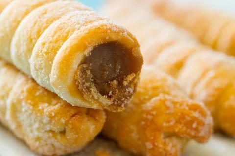 Cookie rolls with chocolate Stock Photos