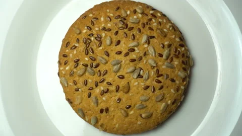 Cookie rotating on white plate. Top view Stock Footage 85992133