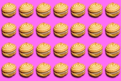 Cookie sandwich pattern with a shadow on a pink background. Stock Photos