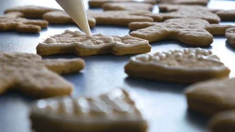 Cookie in shape of christmas tree is decorated with glaze, closeup color graded Stock Footage 83671432