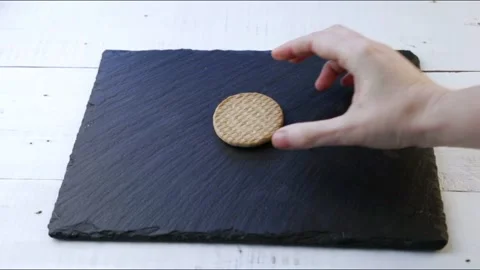 Cookie that turns into crumbs by touching it with a finger Stock Footage 143464298