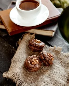 Cookie with walnut and a cup of coffee Stock Photos