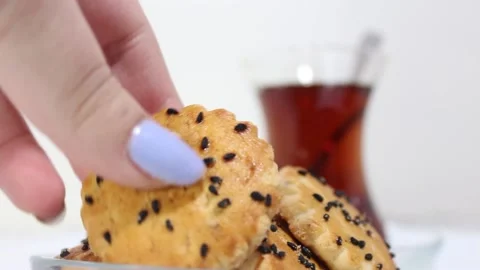 Cookies and tea, biscuits with black cumin and turkish tea turn around Stock Footage 232873095
