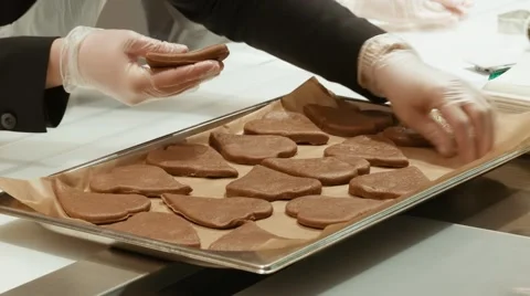 Cookies are displayed on a baking sheet hands 스톡 동영상 47584980