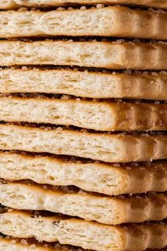 Cookies background. Stack of cripsy sweet chips biscuits Stock Photos