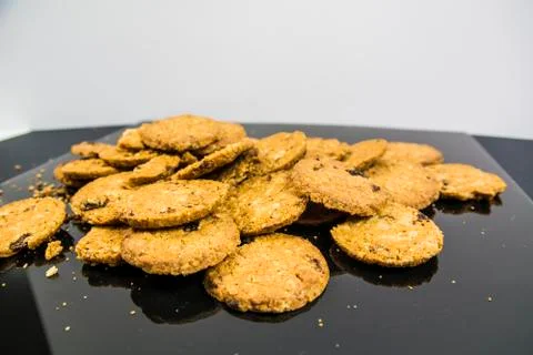 Cookies on black surface Stock Photos
