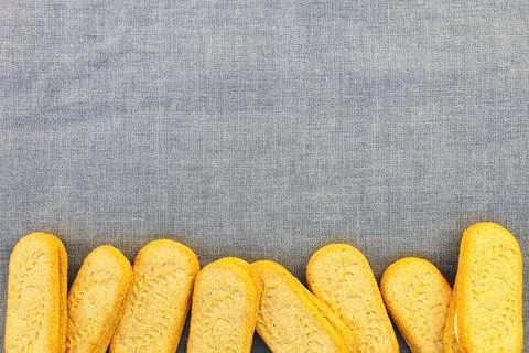 Cookies border frame on gray textile background. Top view, flat lay style. Stock Photos