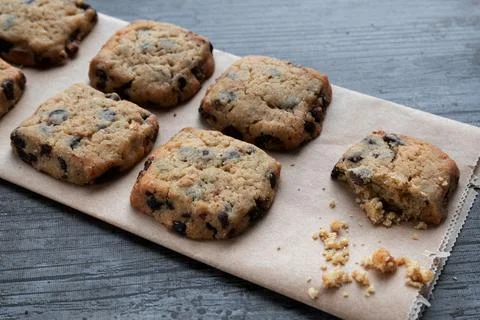 Cookies with dark chocolate chips on rustic background Stock Photos