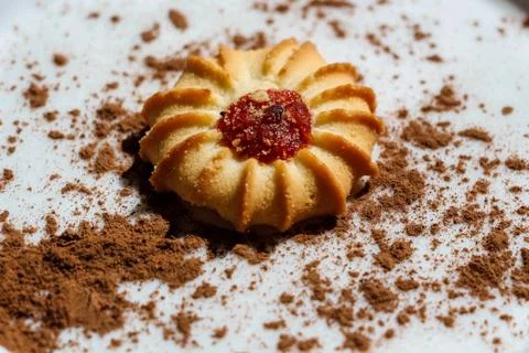 Cookies with a drop of raspberry jam, with a short pastry. Stock Photos