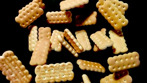 Cookies fly up and fall down on a black background Stock-Footage 279456416