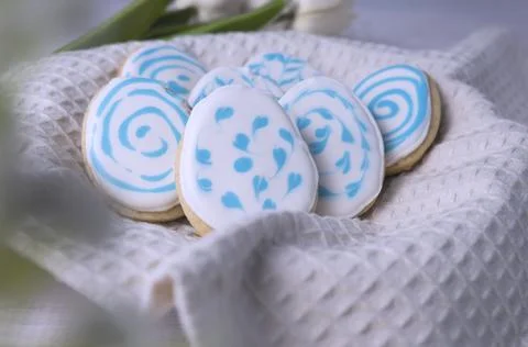 Cookies in the form of eggs on a fabric substrate, preparation for Easter. Stock Photos