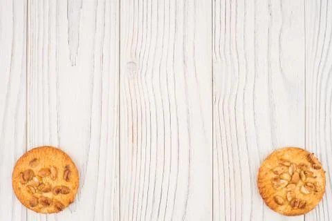 Cookies with peanuts on an old white table. Stock Photos