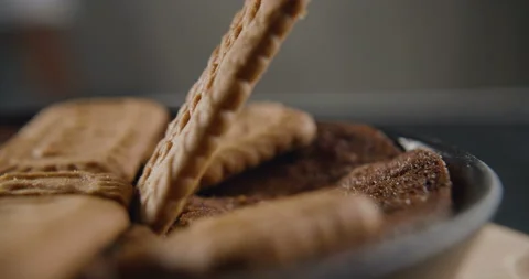 Cookies in slow motion falls on sponge cake. 4K video Stock Footage 101369076
