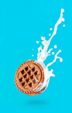 Cookies with a splash of milk Stock Photos