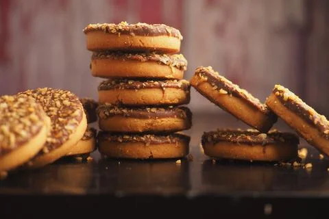 Cookies stacked on a table in a kitchen setting 스톡 사진