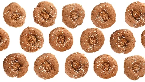 Cookies with walnuts rotate on a white background. Looped video. Stock Footage 166693834
