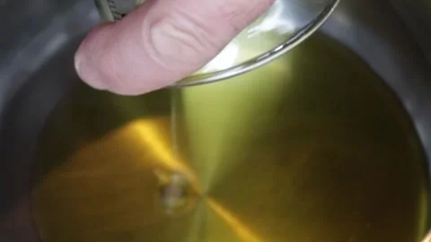 Cooking: Adding olive oil to hot pan Video stock 278348151