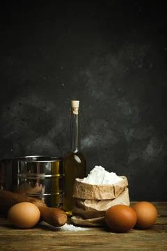 Cooking and baking background. Old kitchen with products and ingredients flou Stock Photos