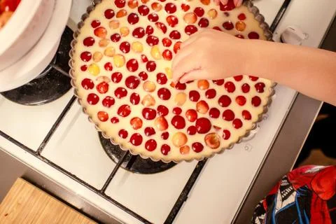 Cooking and baking cherry pie with almond slices Stock Photos