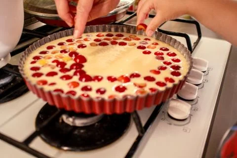 Cooking and baking cherry pie with almond slices Stock Photos