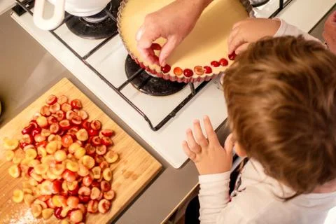 Cooking and baking cherry pie with almond slices Stock Photos