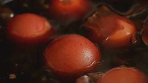 Cooking  and dyeing Easter eggs in onion husks. Stock Footage 74149173