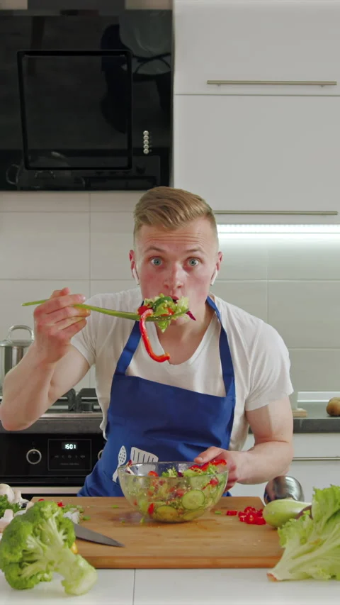 Cooking and grooving in the kitchen with fresh ingredients and good vibes Stock Footage 341761750