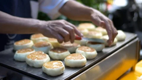 Cooking and selling sweets, flat cakes, street food close view Stock Footage 71391711