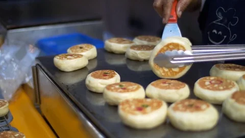 Cooking and selling sweets, flat cakes, street food close view Stock Footage 71392182