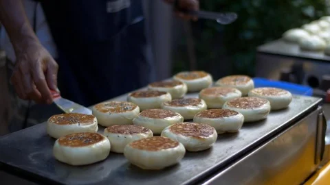 Cooking and selling sweets, flat cakes, street food close view Stock Footage 71392334