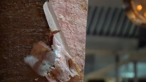 Cooking and slcing Turkish doner at a restaurant, close up Video stock 106625739