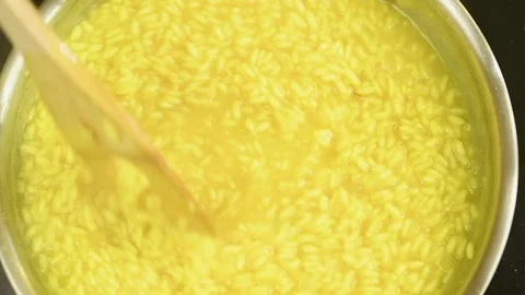 Cooking and stirring risotto in the frying pan. Stock Footage 162057846