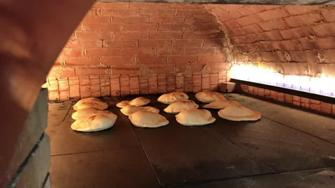 Cooking Arabic breads Stock Footage 197018381