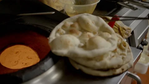 Cooking of authentic indian Naan bread Stock Footage 167269475