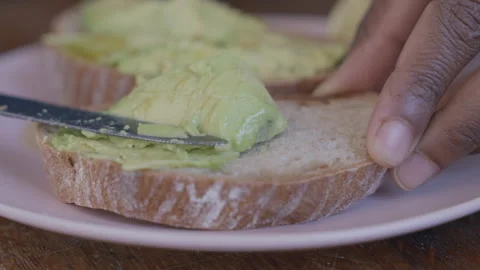 Cooking avocado on toast Stock Footage 255031503