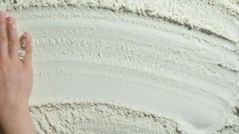 The cooking background is drawn by the hand over the wheat flour, top view Stock Footage 288197867