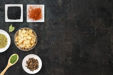Cooking background with plates with different types of spices. Asian spices l Stock Photos