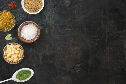 Cooking background with plates with different types of spices. Asian spices l Stock Photos