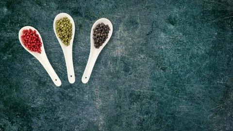 Cooking background with spoon with different types of spices. Asian spices li Stock Photos