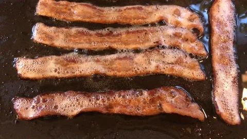 Cooking Bacon on Griddle Stock Footage 86715906