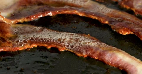 Cooking bacon strips. Stock Footage 143976055