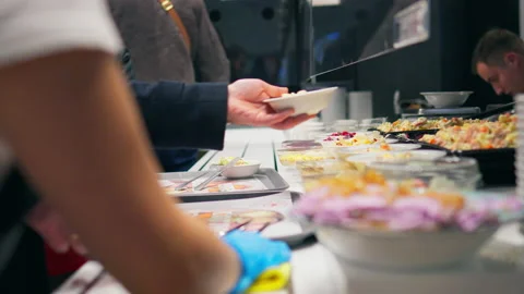 Cooking, Baker fast cooking Attentively Prepares food for the Swiss table Fo Stock Footage 233521094